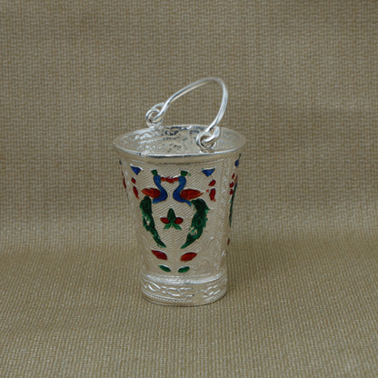 High-quality image of the silver bucket with intricate peacock design, perfect for use in spiritual practices.