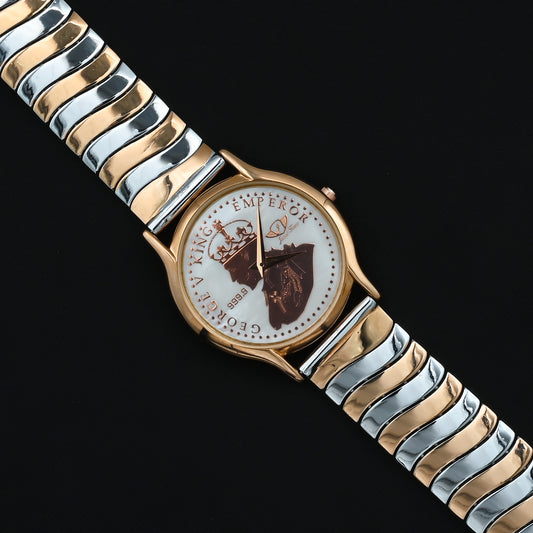 Elegant gold-plated George V silver watch with wave design.