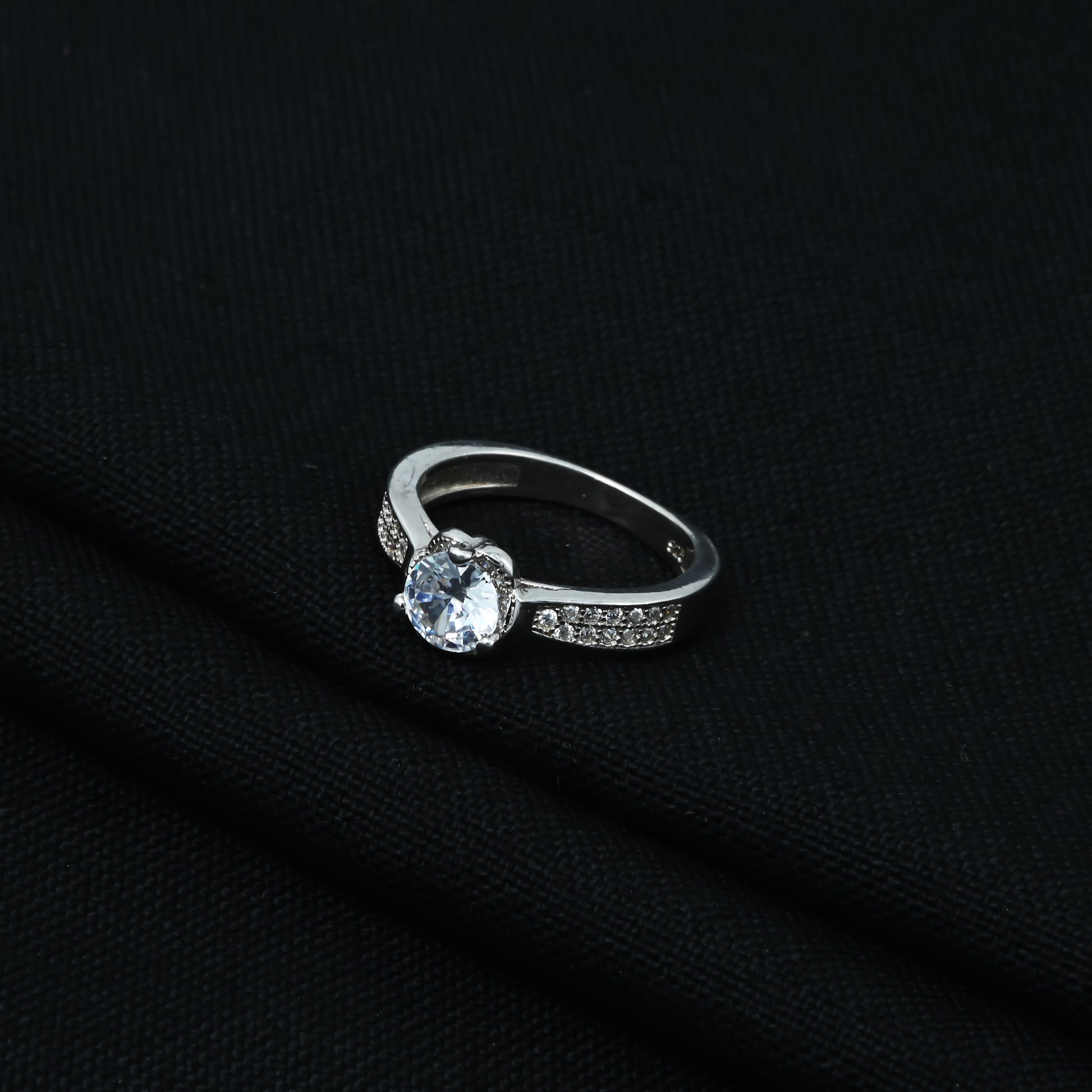 Beautifully crafted silver ring adorned with white American diamond accents.