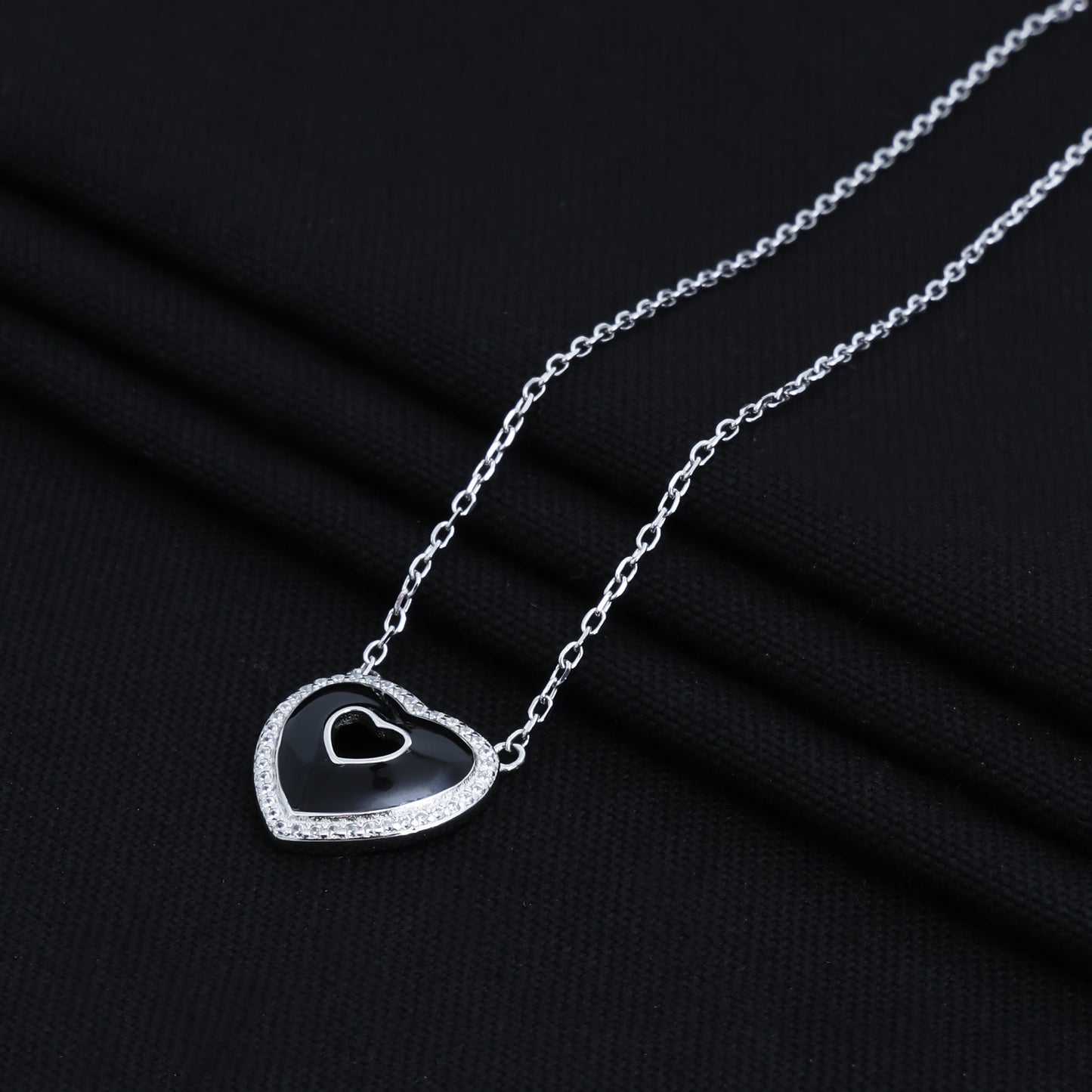 Elegant black heart pendant made of sterling silver on a chain