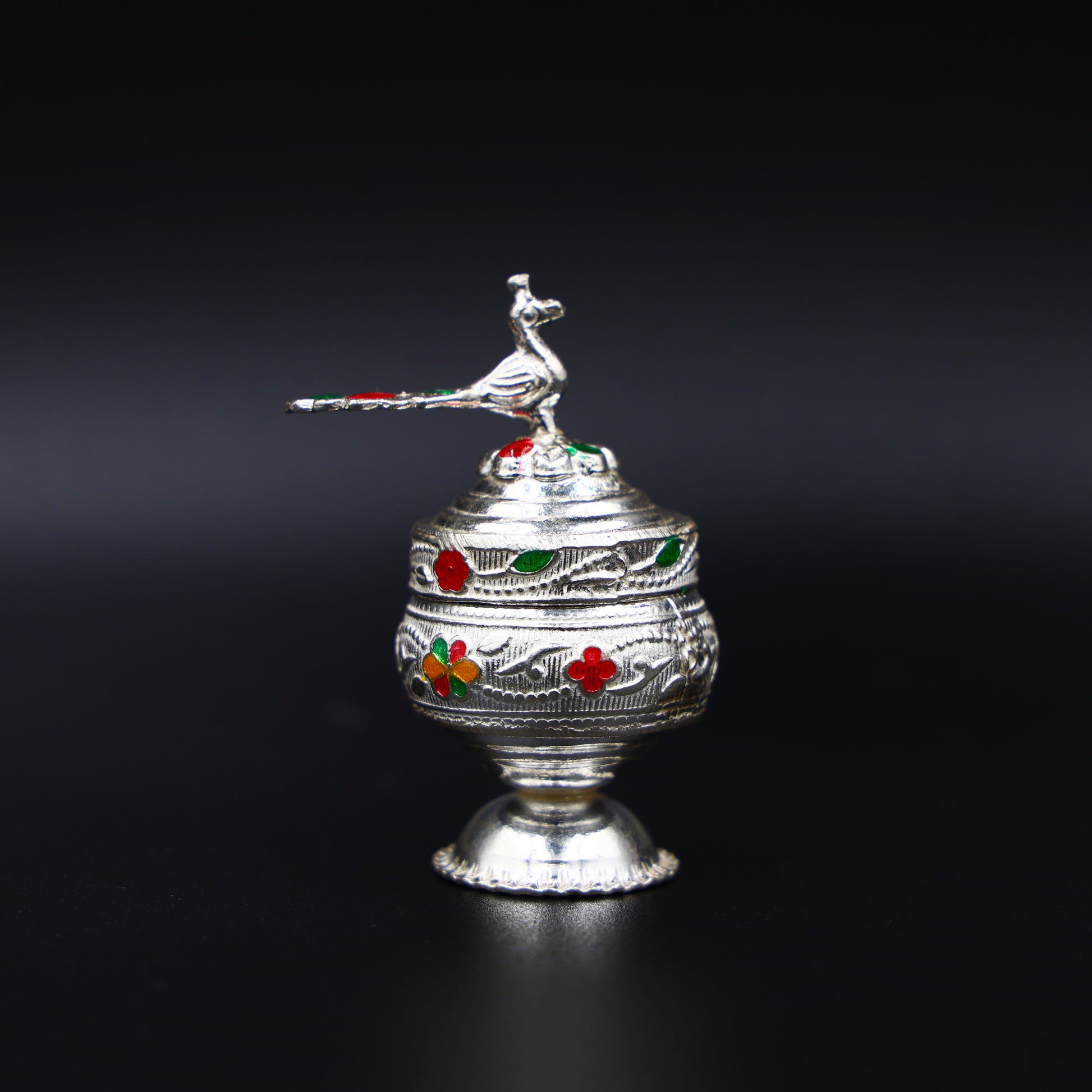 Elegant silver sindhur box with detailed design, adding a touch of tradition to your worship space.