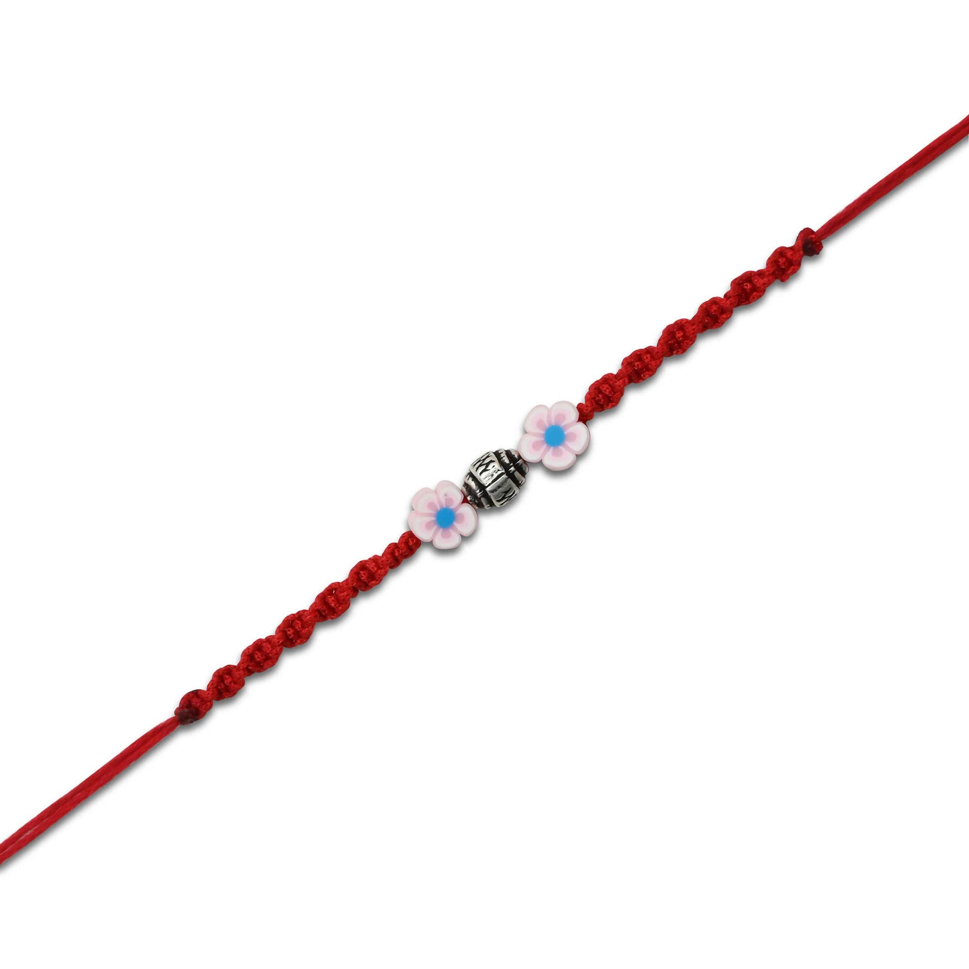 Boys' Rakhi featuring a silver bead centerpiece and soft pink flower accents.