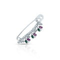 Beautifully designed silver saree pin featuring green and purple stones