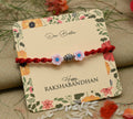 Silver center bead design with pink flowers, perfect Rakhi for boys