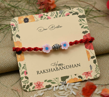 Silver center bead design with pink flowers, perfect Rakhi for boys