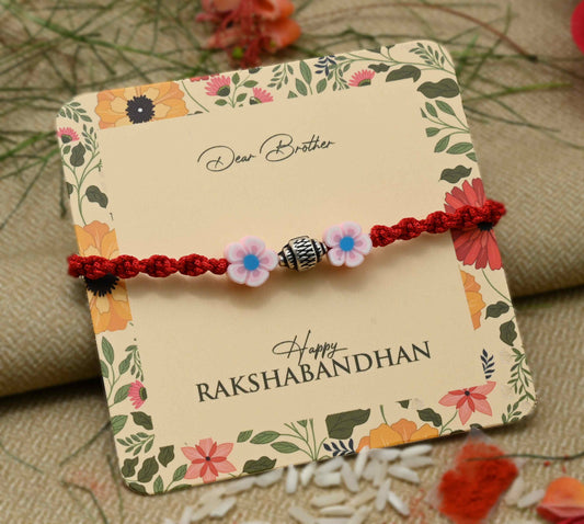 Silver center bead design with pink flowers, perfect Rakhi for boys