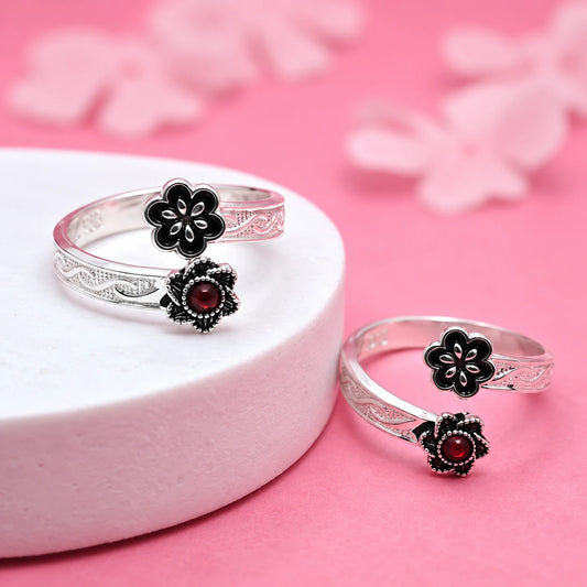 Elegant Silver Toe Ring with Floral Accent red stone