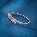 Stylish silver kada with rose gold plating and diamond studs.