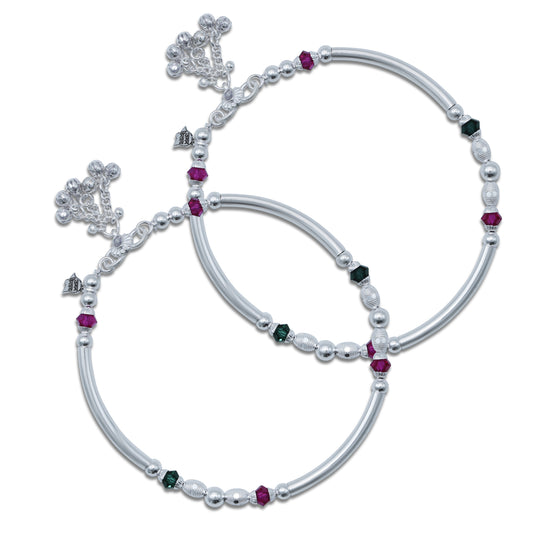 Elegant kada payal in sterling silver adorned with pink and green gemstones