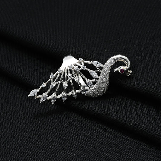 Close-up of a silver ring adorned with a beautiful white peacock motif, perfect for adding a touch of grace.