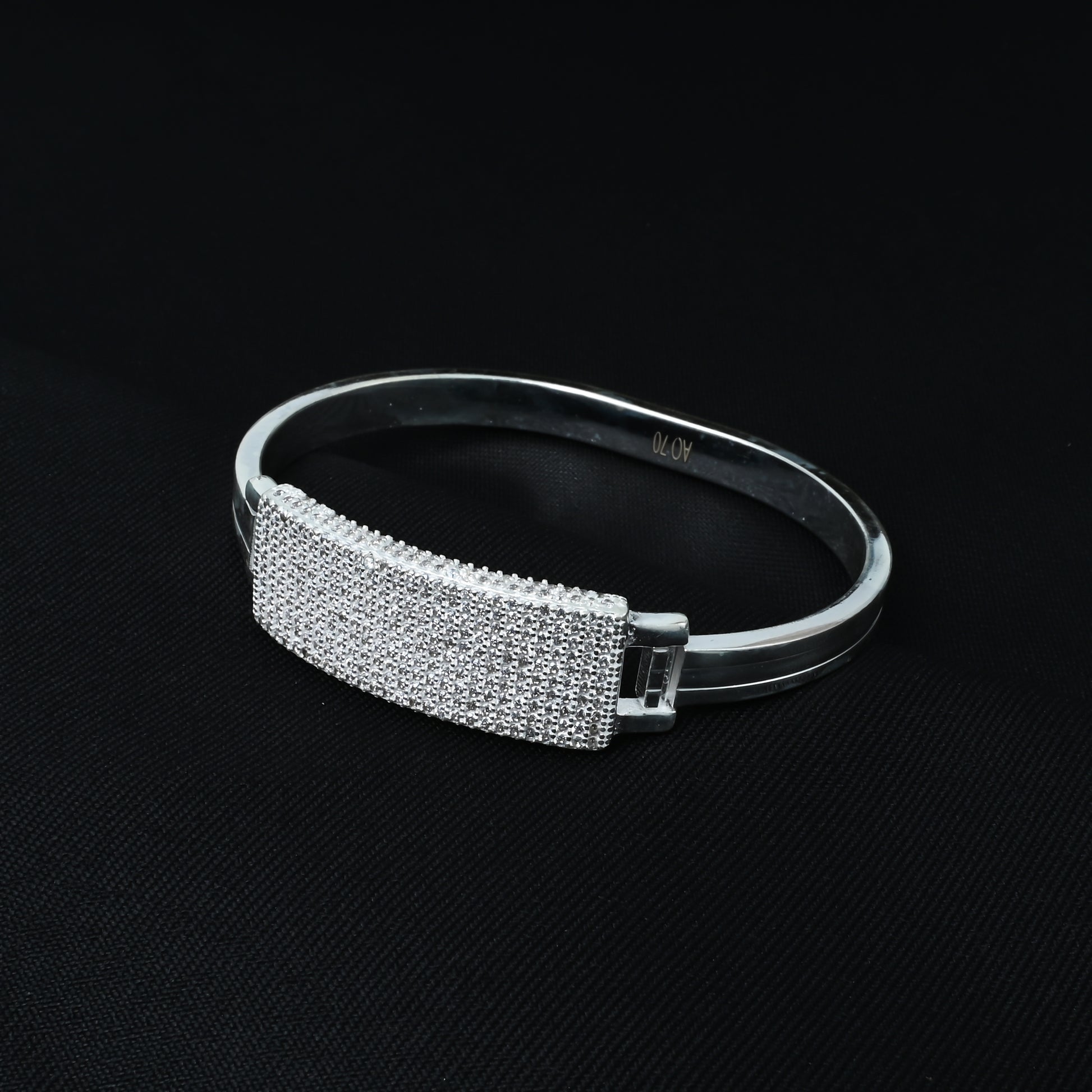 Sparkling silver kada adorned with crystals all over