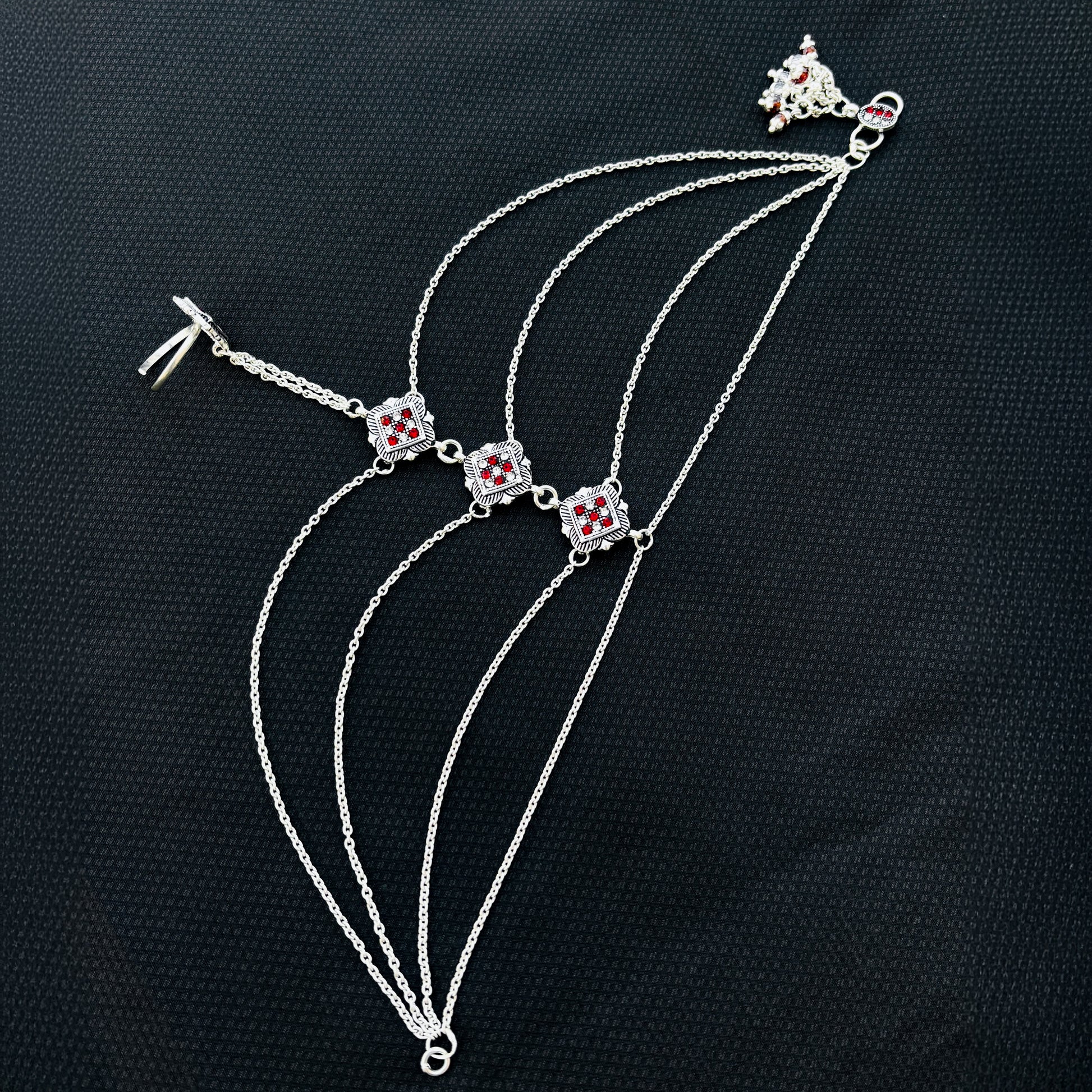 Elegant silver payal featuring a floral design with vibrant stones.