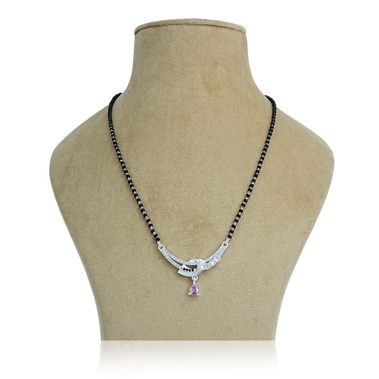 Traditional black beaded silver mangalsutra featuring a purple gemstone