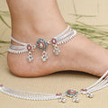 Silver anklets featuring a floral design with gemstones