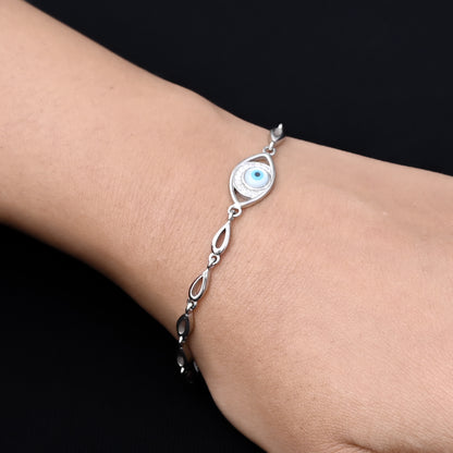 Silver evil eye bracelet designed as a protection charm; a blend of elegance and spiritual significance.