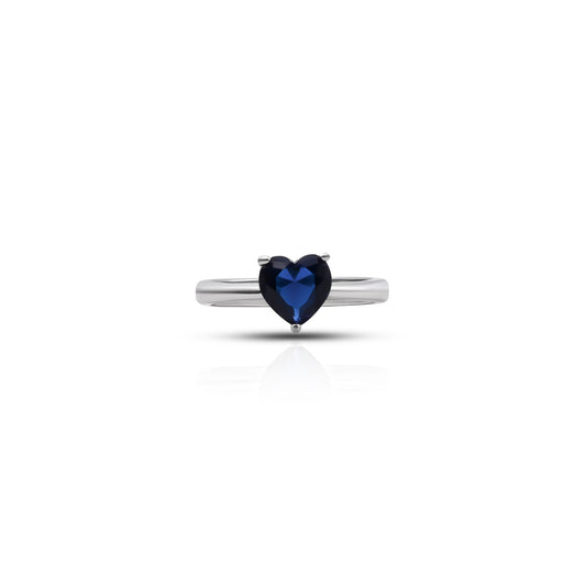 Heart-shaped blue sapphire set in silver ring.