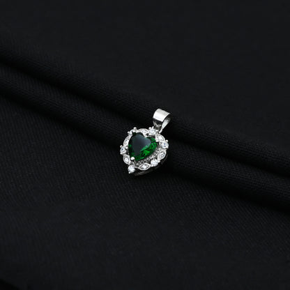 Stylish silver pendant for girls, showcasing a green gem at the center of a heart-shaped design