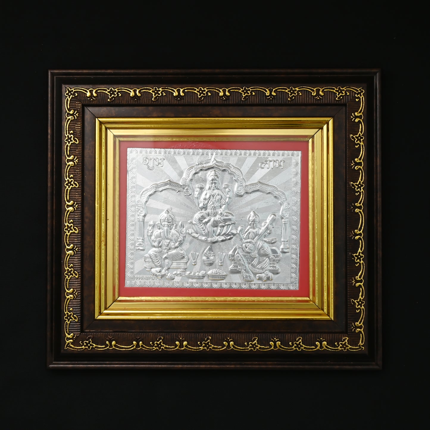 Pure 999 silver photo frame with intricate Lakshmi, Saraswati, and Ganesha designs, perfect for gifting