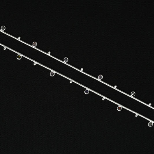 Elegant silver anklet with a Celtic-inspired design, featuring vibrant colorful accents for a stylish look