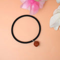 An Elegant Bracelet adorned with a small Rudraksha