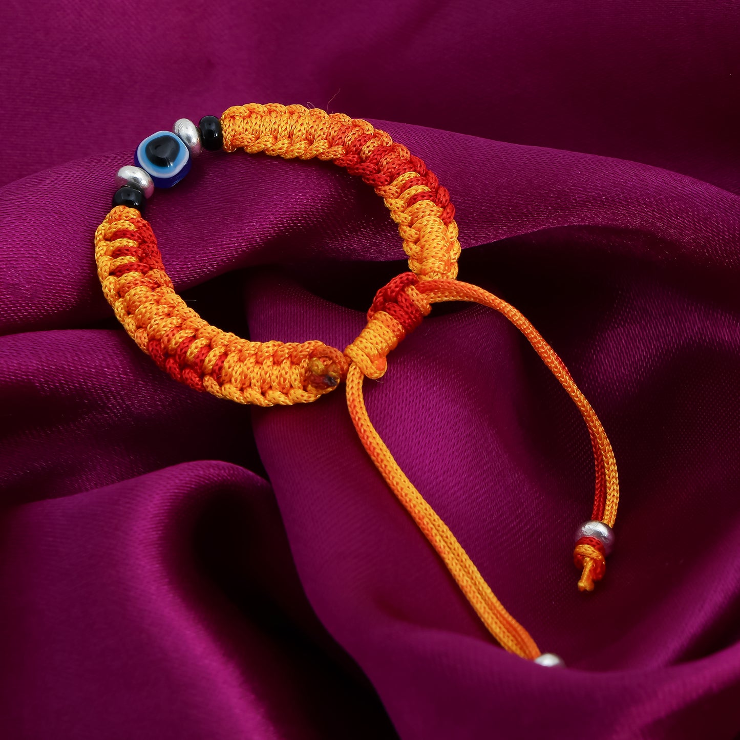 Silver Evil Eyes Adjustable Orange Dhaga Bracelet