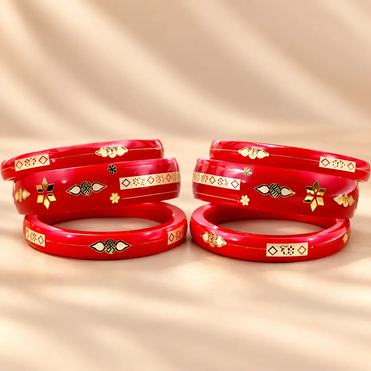 Red Gold Bangle Set Featuring Swastika Design – Stylish & Cultural.