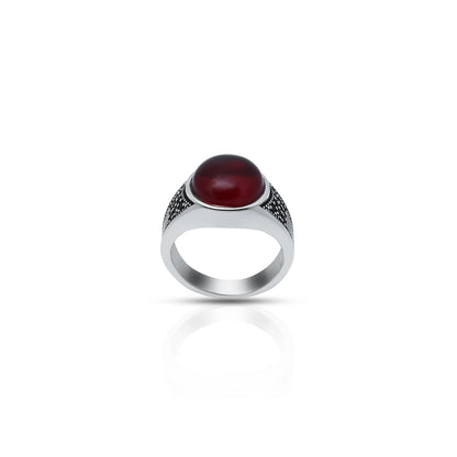 Elegant sterling silver ring with a bold red gemstone, 'The Blood Moon' design, ideal for boys