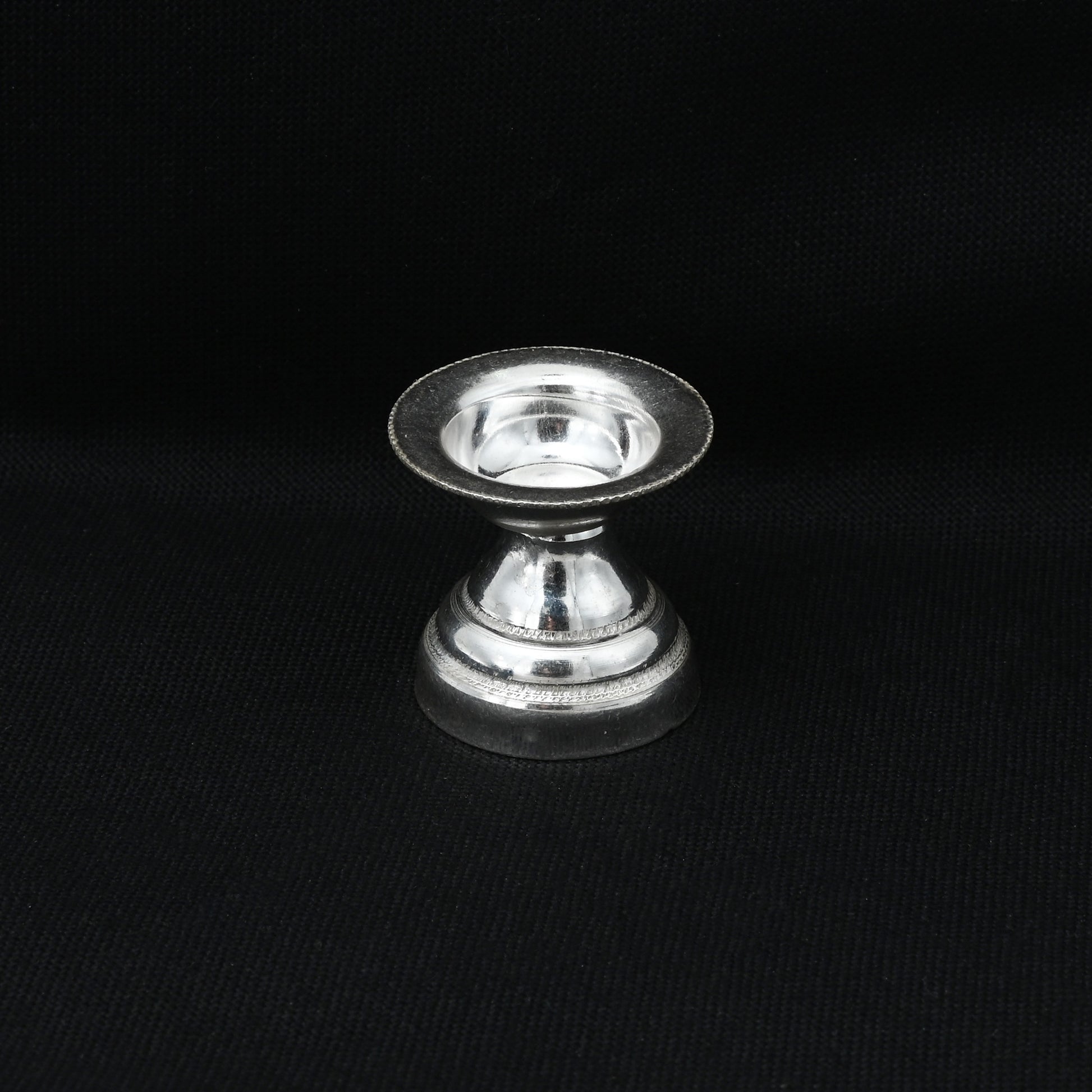 Elegant silver Puja item featuring a Goddess design