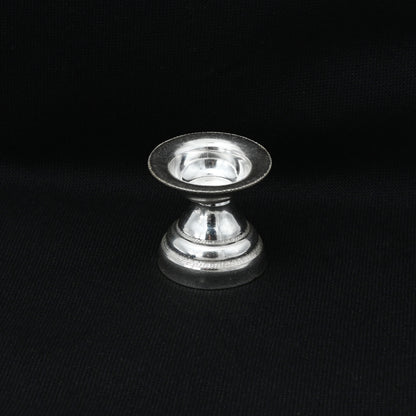 Elegant silver Puja item featuring a Goddess design