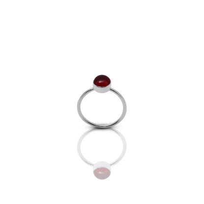 Bold sterling silver ring for girls with a deep red gemstone, inspired by the dramatic beauty of a blood moon.