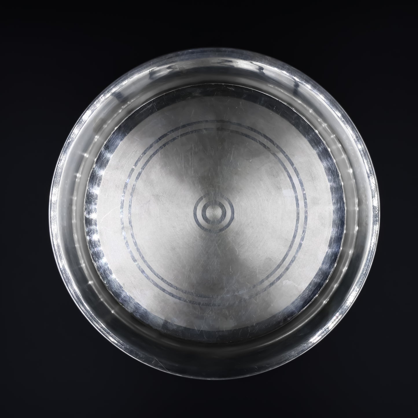 Close-up of the beautifully crafted silver dinner plate, ideal for formal dining.