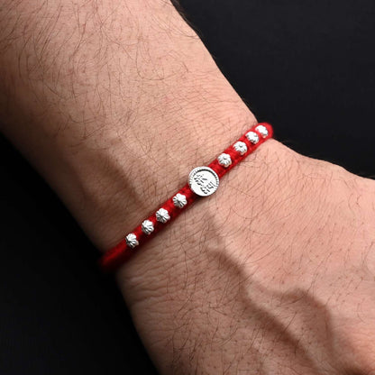 Traditional Rakhi with 'Mere Bhaiya' written in silver and adorned with a floral design, ideal for boys