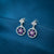 Silver Earrings With Purple Flower Stone in Circle Design