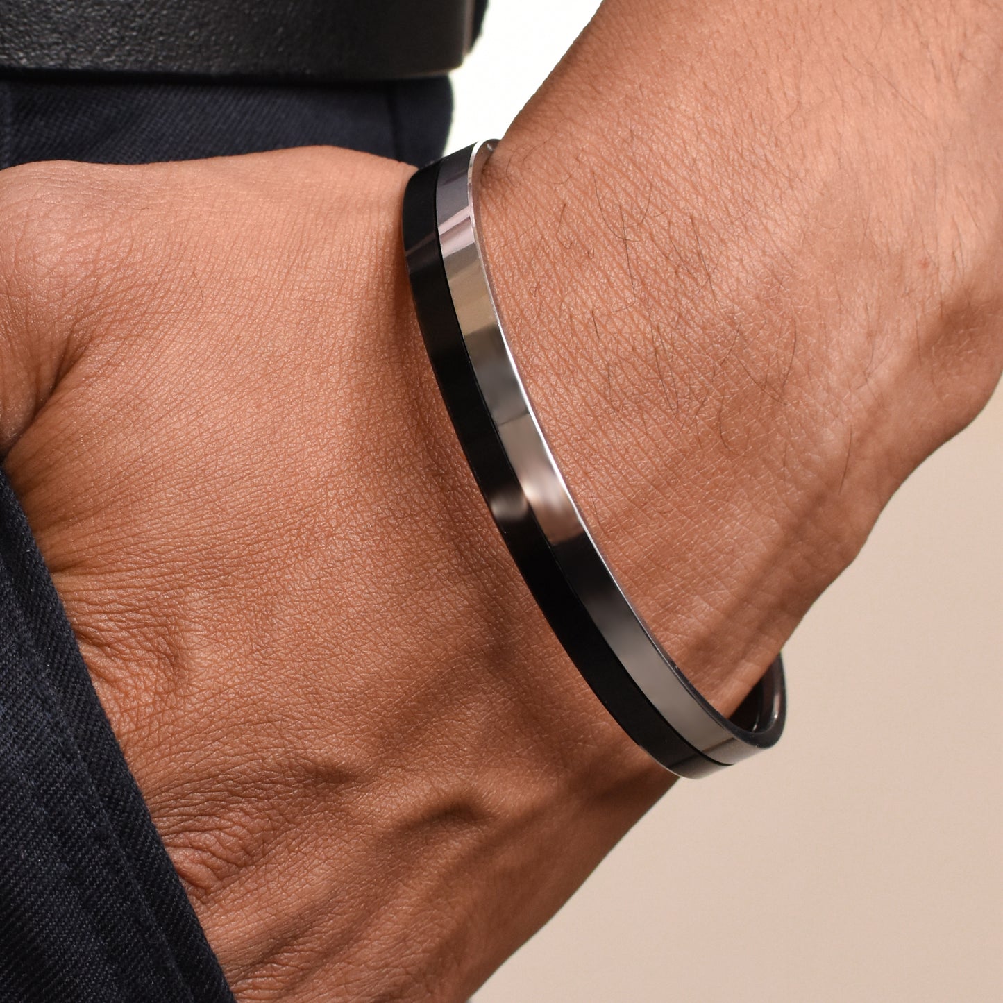 Charming sleek men's kada showcasing a bold black and silver design for a trendy appearance