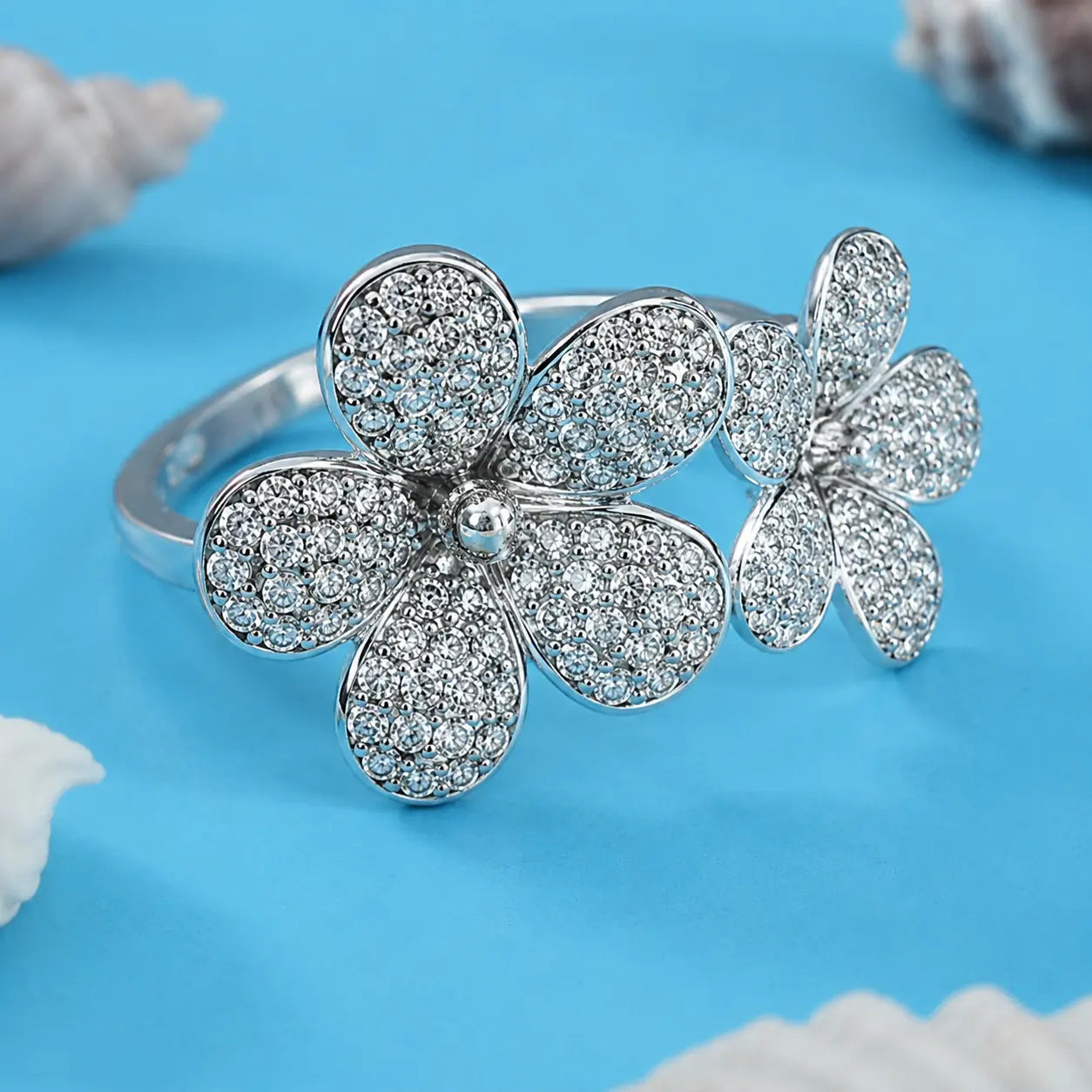 Silver Ring with Two Flowers and Sparkling White Crystals.