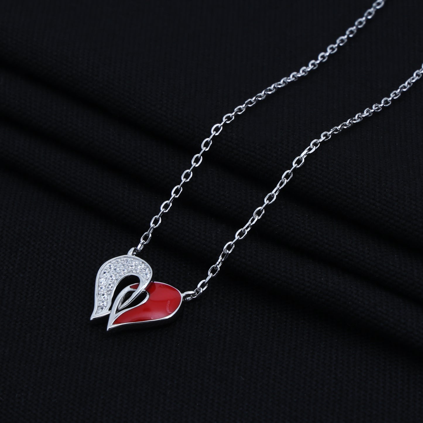 Charming silver heart pendant in red and white on a chain