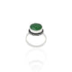 Close-up of a silver ring with a gorgeous green gemstone, perfect for adding a pop of color and sophistication.