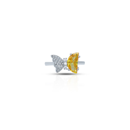 Silver ring with a butterfly design and a yellow stone