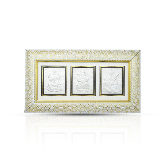 Elegant 999 silver frame featuring Laxmi, Ganesh, and Saraswati idols, perfect for home decor