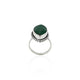 Close-up of a silver ring with a stunning green gemstone, perfect for adding a vibrant touch to any outfit.