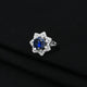 Stylish silver ring with a floating blue flower, offering a graceful and charming design.