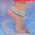 Elegant silver payal with flower design and multiple green beads for a vibrant look