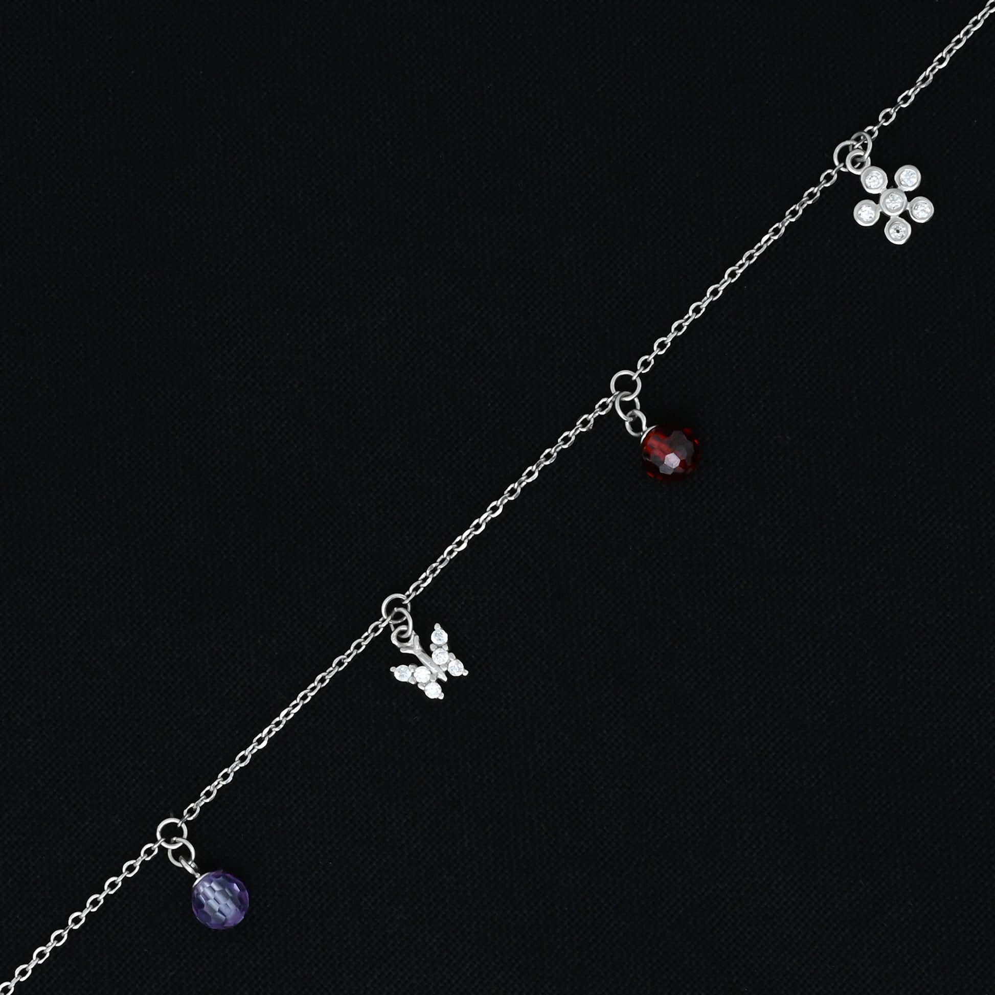 Stylish bracelet for girls, combining a butterfly and flower design with a polished silver finish.