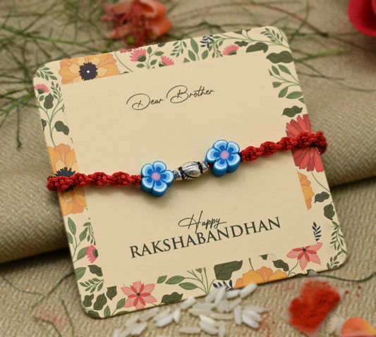 Sterling Silver Blue Flowerd Rakhi For Boys
