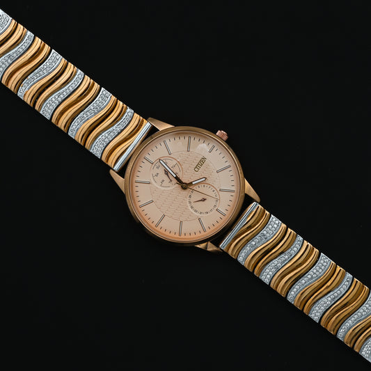 Elegant gold-plated silver wristwatch featuring wavy design.