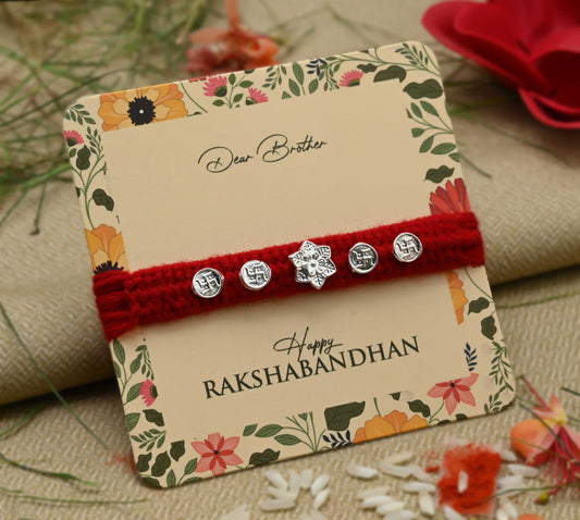 Silver center flower design with Swasthik symbol, perfect Rakhi for boys.