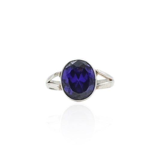 Silver ring featuring a stunning midnight blue gemstone.