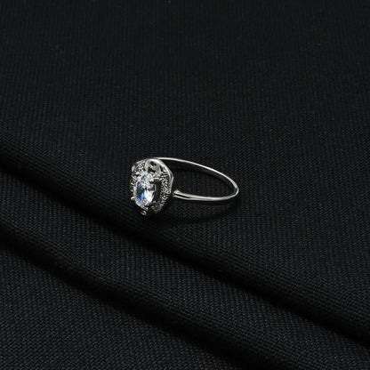 Elegant silver ring with a shiny stone, combining luxury and modern style.