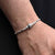 Stylish sterling silver bracelet for boys with a floral design and silver beads