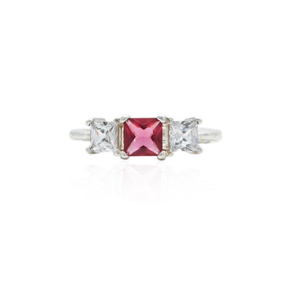 Silver ring featuring a pink baguette-shaped gemstone